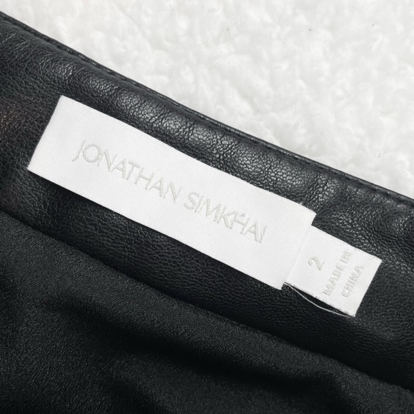 JONATHAN SIMKHAI • Black Vegan Leather Jayla Pleated Asymmetrical Midi Skirt, 2 - Picture 13 of 16